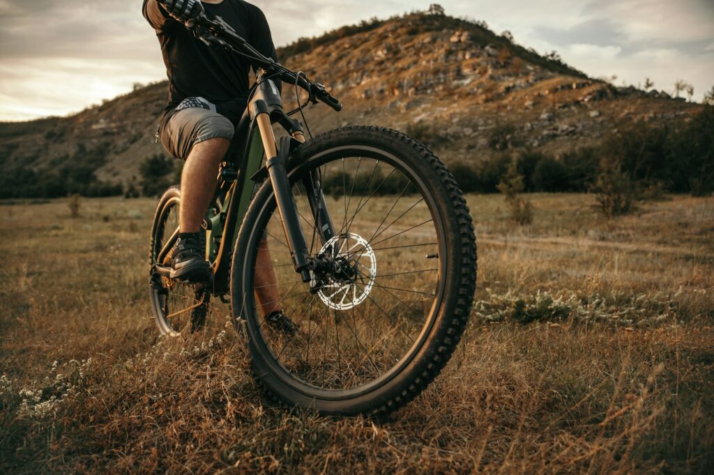 Cyclist on electric bike in mountains