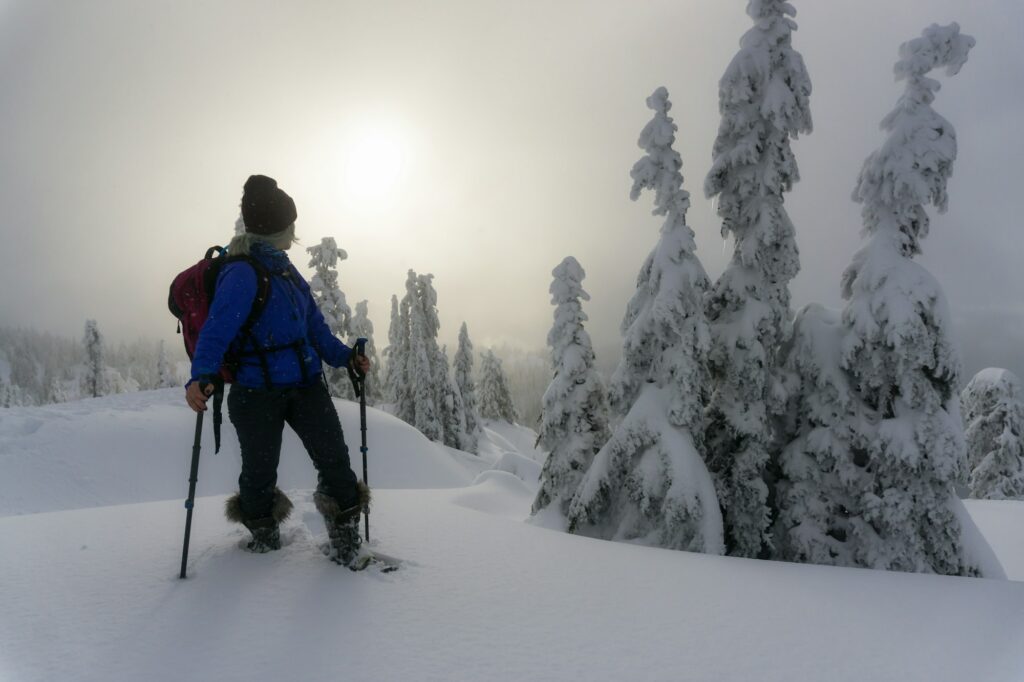 Young Woman Snowshoeing in fresh snow